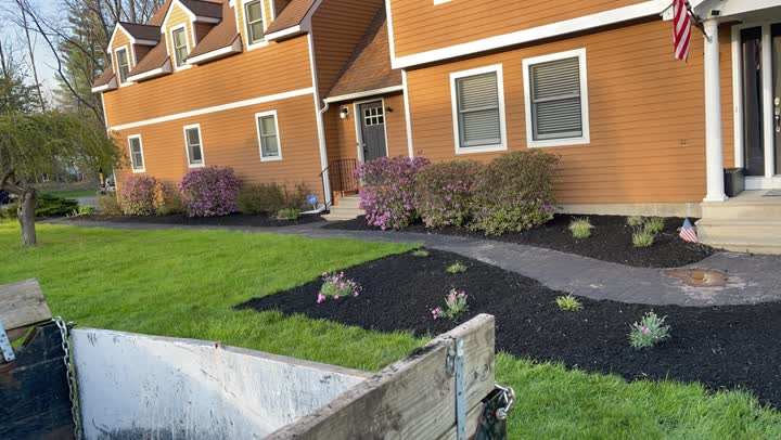 Black mulch flower bed installation around a residential walkway in Greenfield NY